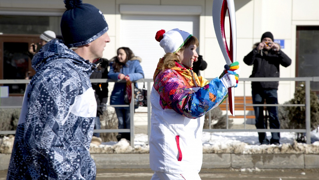 Torch with the Olympic flame in our hands!