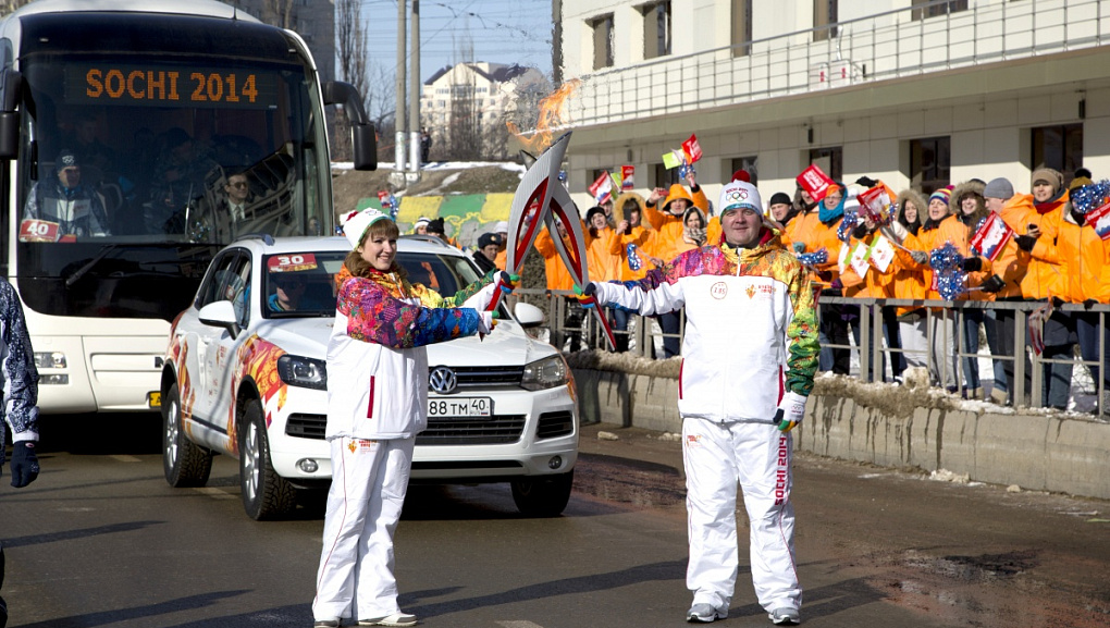 Torch with the Olympic flame in our hands!
